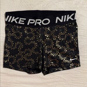 Nike Women's Athletic Shorts in Black and Gold